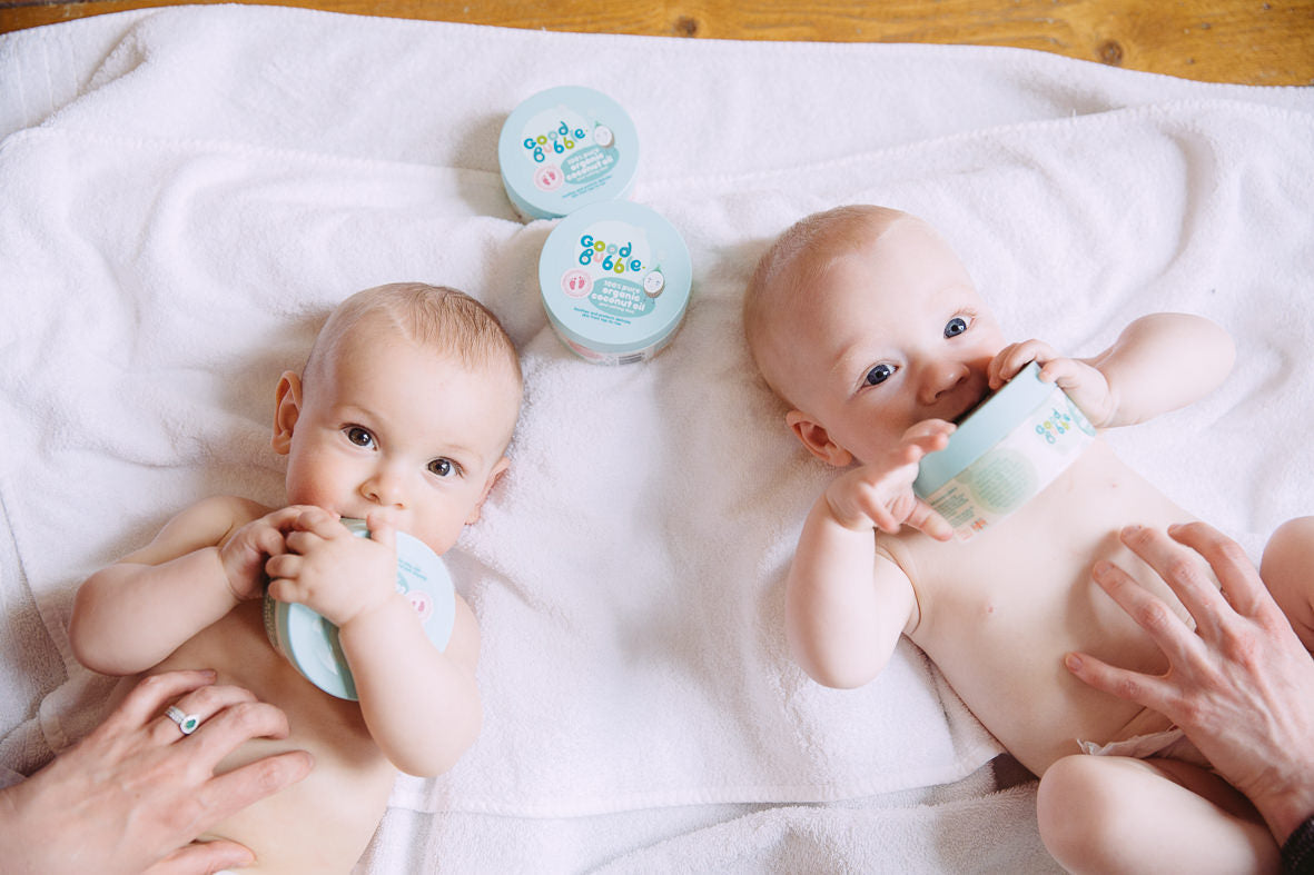 Two babies enjoying a baby massage with good bubble products 